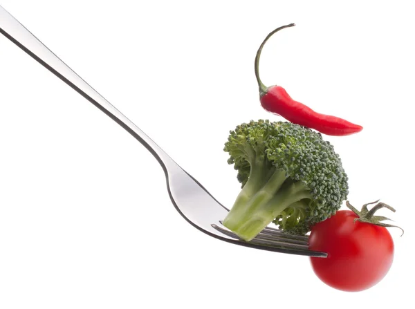 Fresh raw vegetables on fork — Stock Photo, Image