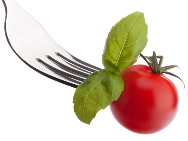 Basilikum und Tomaten auf Gabel — Stockfoto