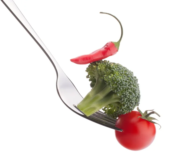 Fresh raw vegetables on fork — Stock Photo, Image