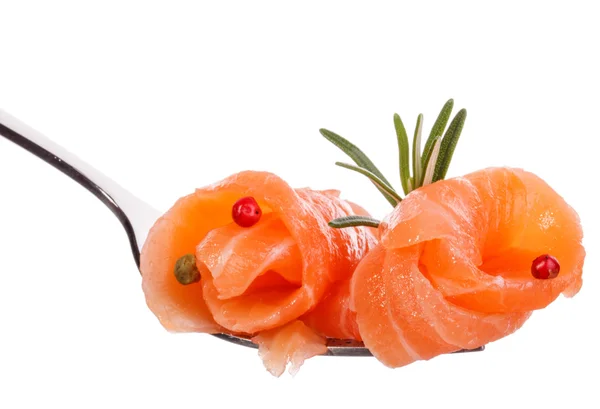 Salmon piece and rosemary leaves on fork — Stock Photo, Image