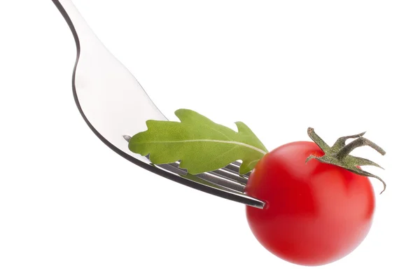 Ensalada de rúcula y tomate cherry en tenedor —  Fotos de Stock