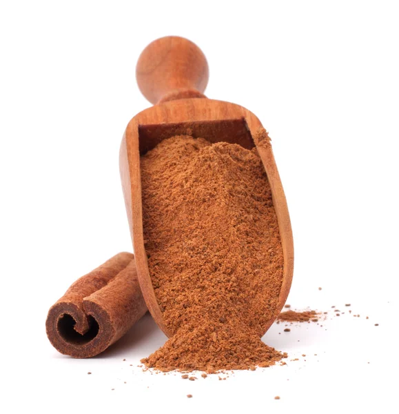 Ground cinnamon powder in wooden scoop — Stock Photo, Image