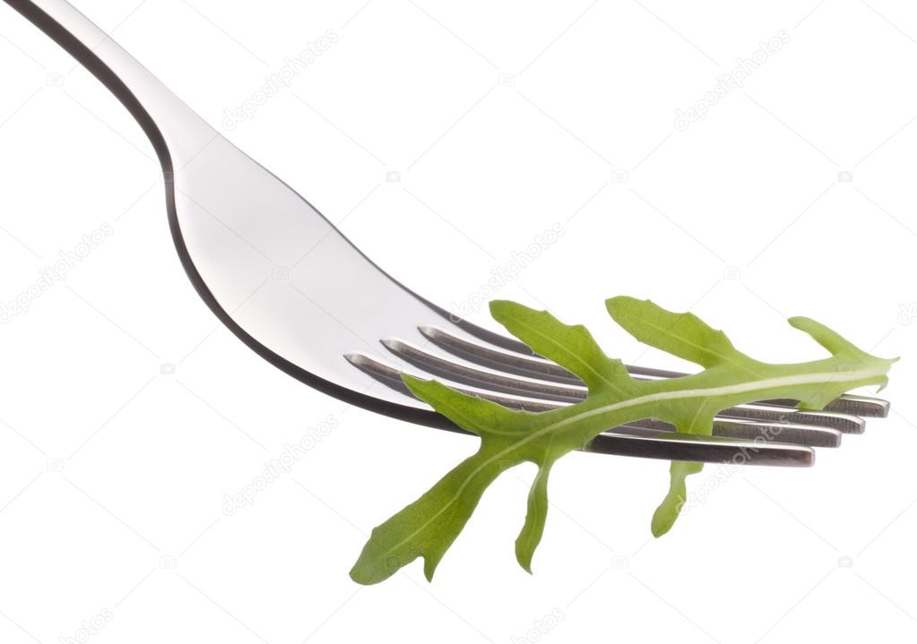 Fresh rucola  salad on fork
