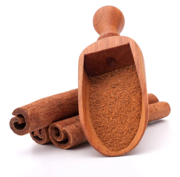 Ground cinnamon powder in wooden scoop — Stock Photo, Image
