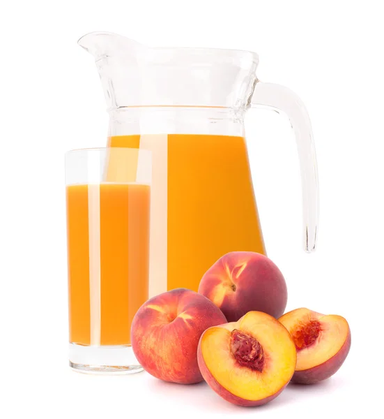 Peach fruit juice in glass jug — Stock Photo, Image