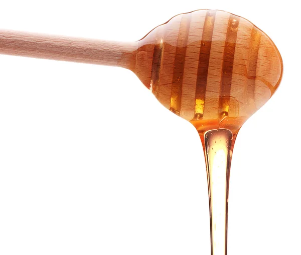 Med z dřevěné honey naběračka — Stock fotografie