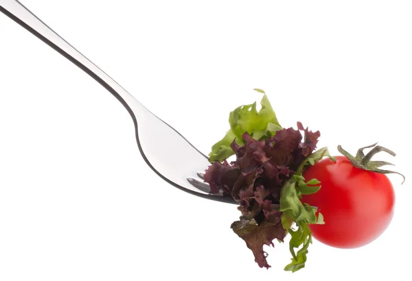 Fresh salad and cherry tomato on fork — Stock Photo, Image