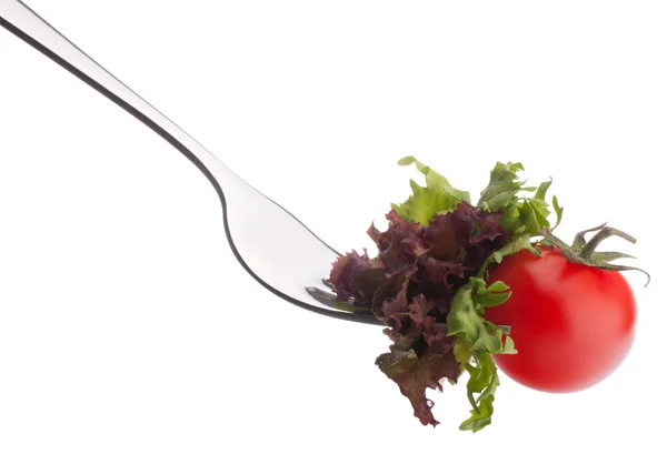 Fresh salad and cherry tomato on fork — Stock Photo, Image