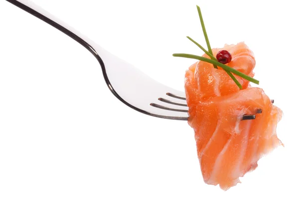 Salmon piece with peppercorns on fork — Stock Photo, Image