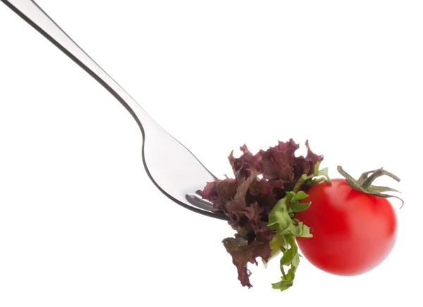 Fresh salad and cherry tomato on fork — Stock Photo, Image