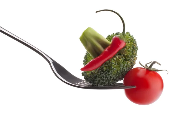 Fresh raw vegetables on fork — Stock Photo, Image