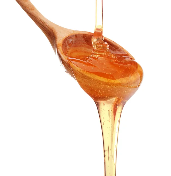 Cuillère avec coulée de miel — Photo