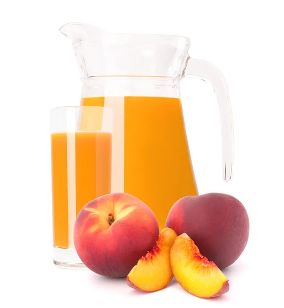 Peach juice in glass jug — Stock Photo, Image