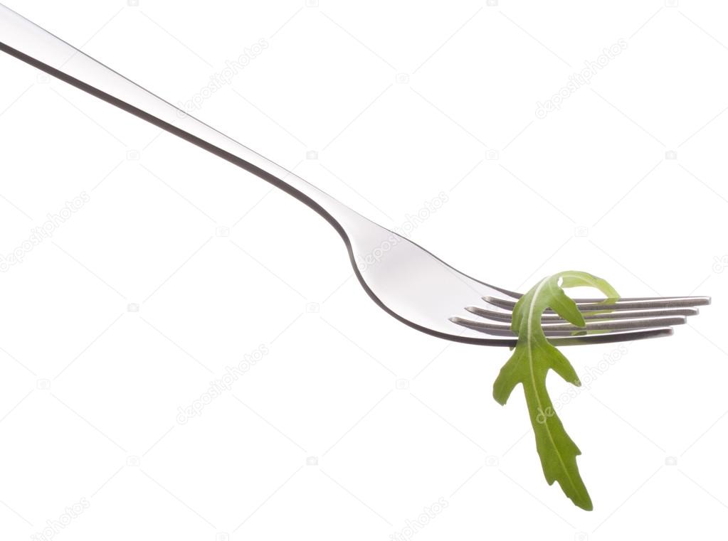Fresh rucola  salad on fork