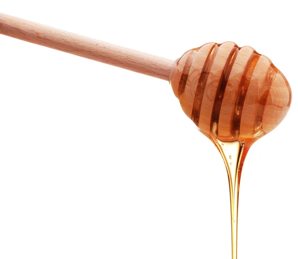 Honung droppade från trä honung strömstare — Stockfoto