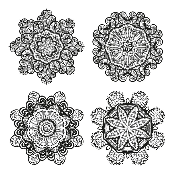 Conjunto de adornos decorativos redondos, motivos florales en blanco y negro — Vector de stock