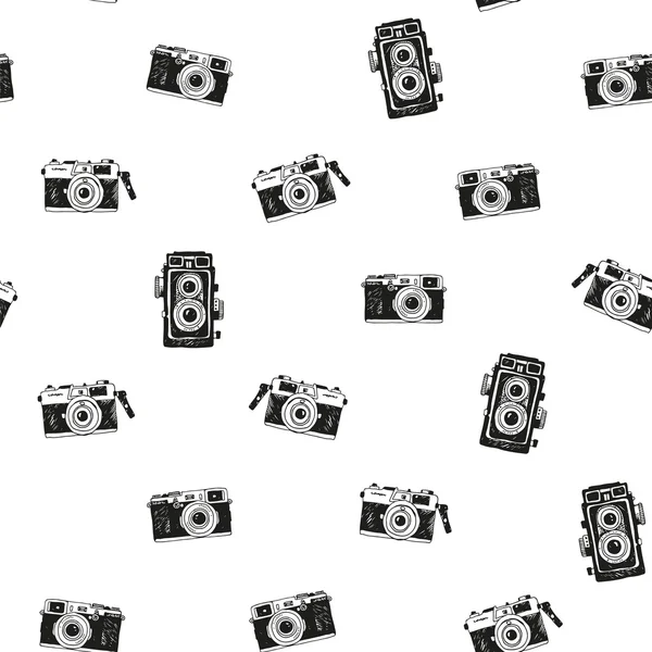Seamless background with hand drawn vintage photo cameras — Stock Vector