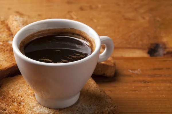 Coffee cup of  espresso with toast on wooden table — Stock Photo, Image