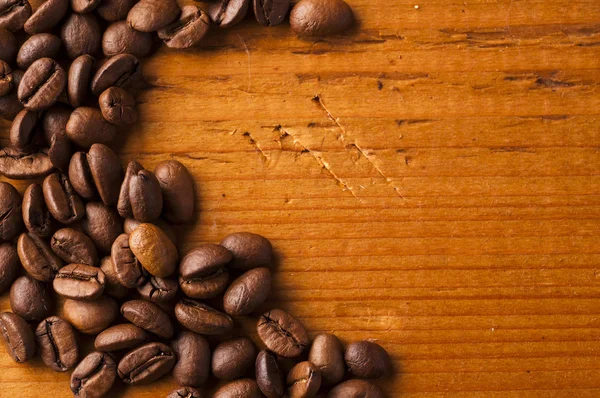 Coffee beans on wooden background — Stock Photo, Image