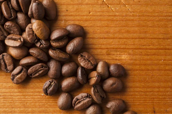 Coffee beans on wooden background — Stock Photo, Image