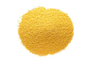 Yellow millet background. View from above. Millet on an isolated white background.