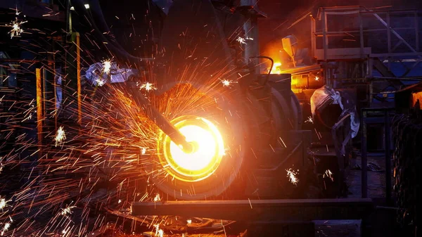 Iron pipe centrifugal pipe casting machine at the foundry.