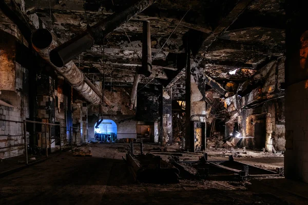 Burnt and ruined interior of industrial building after fire. Consequences of war, fire or other disaster.