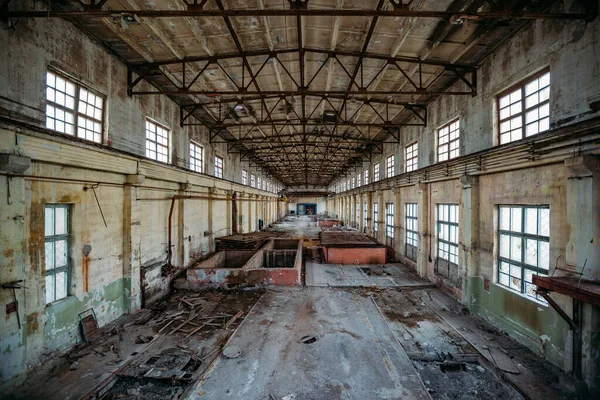 Abandoned concrete factory. Large empty industrial hall