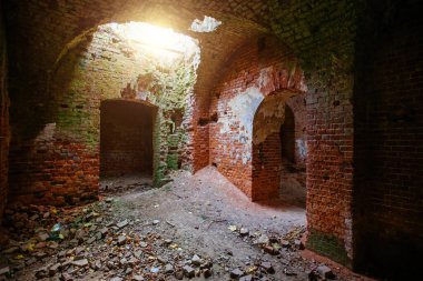 Dark old ancient abandoned red brick ruined historical building.