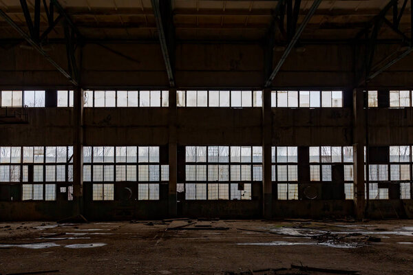 Old abandoned large industrial hall. Empty warehouse.