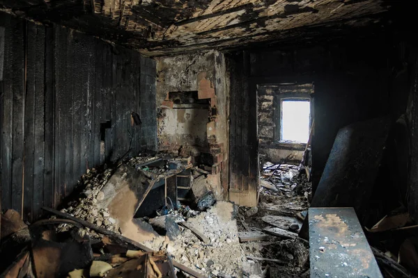 Burnt old house interior. Consequences of fire.