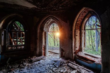 Inside old ruined abandoned historical Khvostov's mansion in Gothic style. clipart