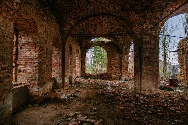 Large ancient vaulted hall of abandoned building.