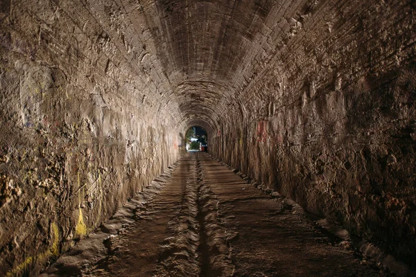 Old historical vaulted underground road tunnel.