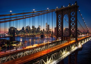 New York City - beautiful sunset over manhattan with manhattan and brooklyn bridge clipart
