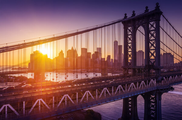 New York City - beautiful sunset over manhattan with manhattan and brooklyn bridge