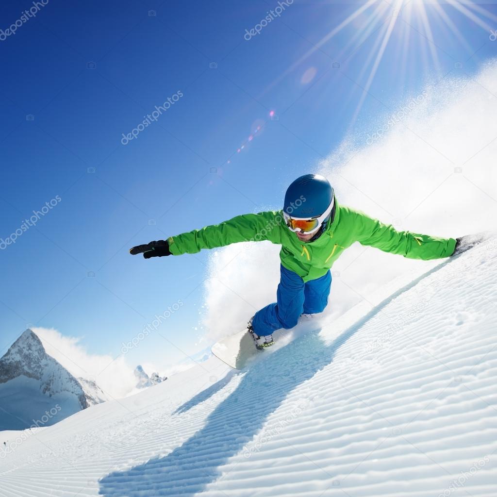 Snowboarder in high mountains