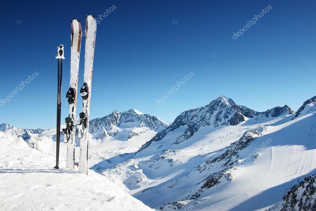 Ski - skiing equipment in high mountains at sunny day