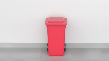 Boş kırmızı bir plastik çöp kutusunun kapağını açmak