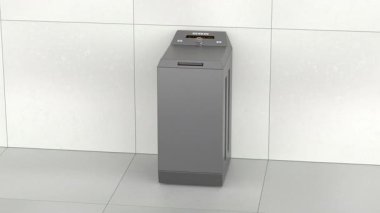 Boş çamaşır odasında siyah üstten yükleme makinesi.