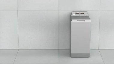 Modern gümüş kaplama çamaşır makinesi banyoda.