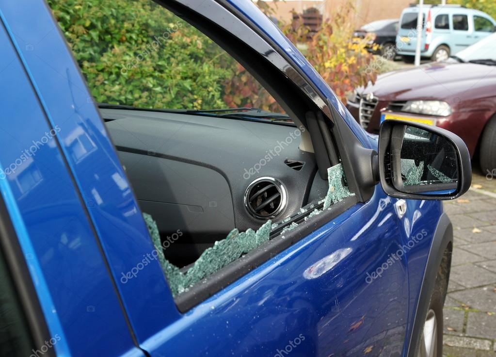 Thieves have broken car window — Stock Photo © scrabble 110123976
