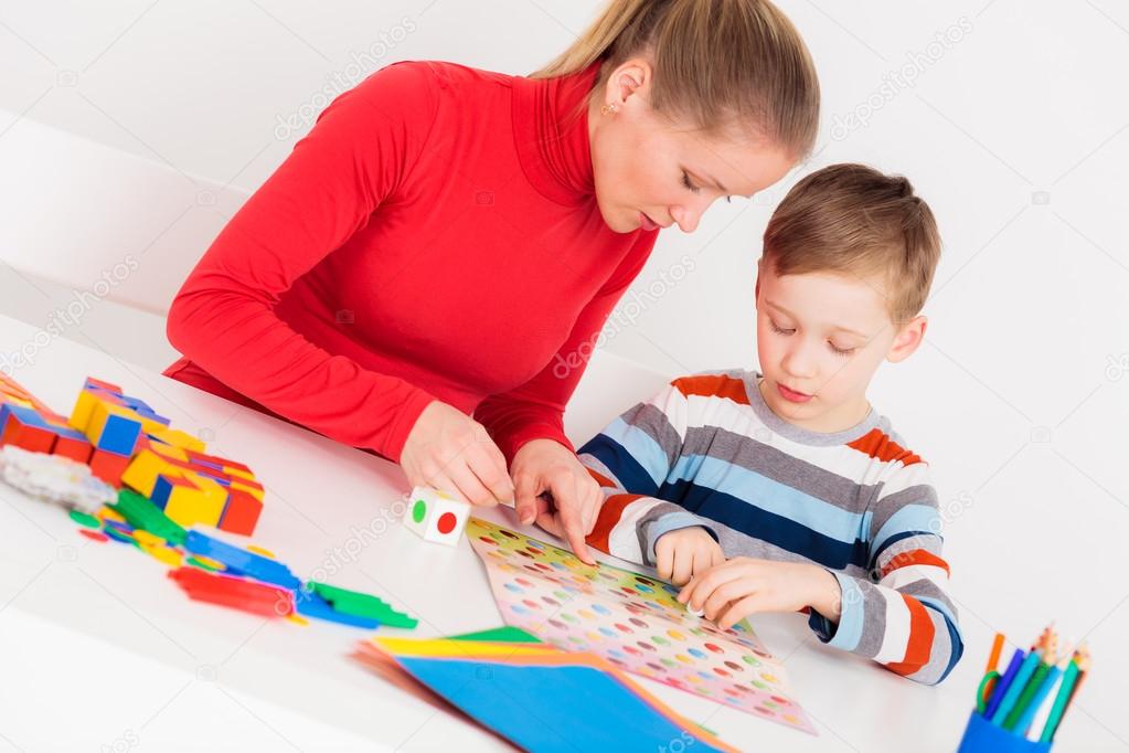 Mother and son playing  in  board game