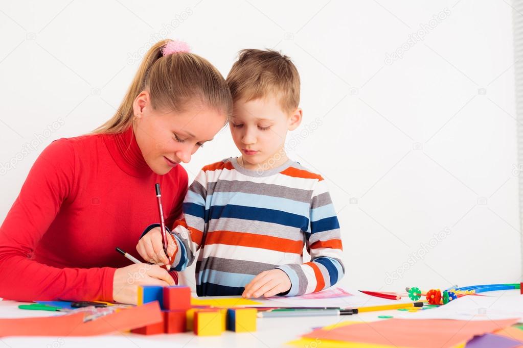 Woman drawing with her son
