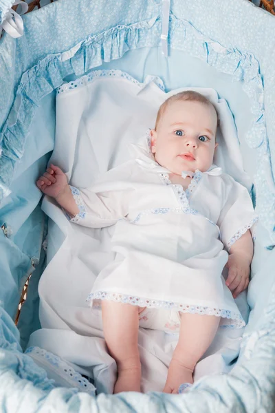 Cute baby boy laying in cradle — Stock Photo, Image