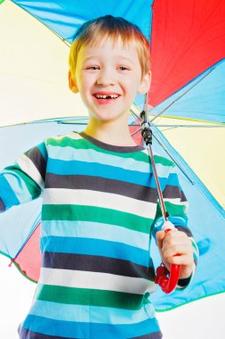 boy with a varicoloured umbrella