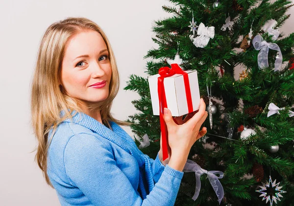 Lovely woman keeping small present — Stock Photo, Image