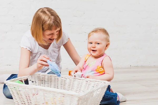 Laughing girls with toys — Stock Photo, Image