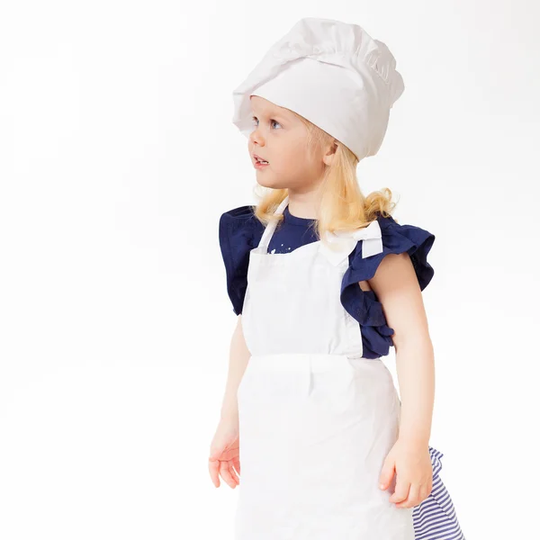 Menina bonita em traje de cozinheiro — Fotografia de Stock