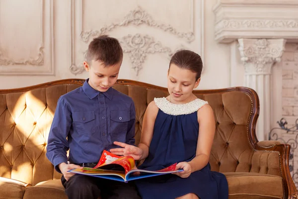 Boy and girl read book